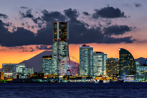 Japan - November 15, 2019 : Fuji Mountain at Sunset with Illumination of Yokohama Bay Foreground, Yokohama, Kanagawa, Japan