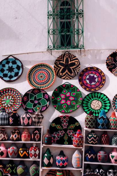 istock Wall filled with a selection of woven baskets and decorative plates. 1492801136