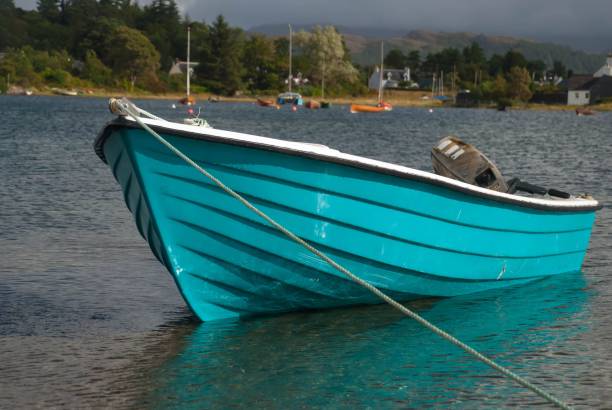 istock Blue boat peacefully floating in the lake in spring 1492801623