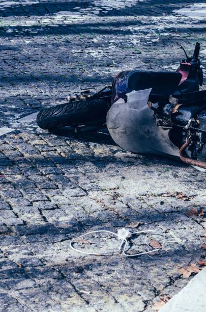 istock Broken motorcycle on the paved ground after the accident 1492802130