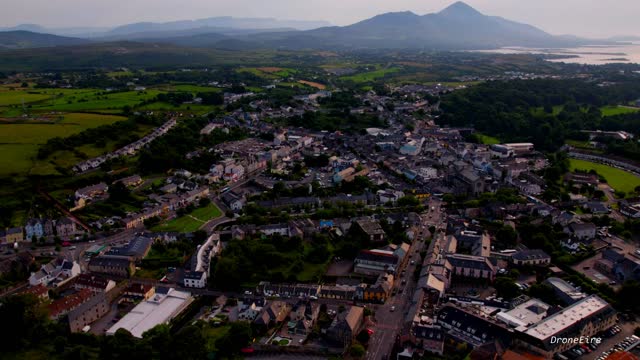 Time lapse drone footage showing Penrhyndeudraeth town in Snowdonia mountains in Wales at sunset