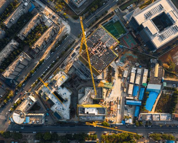 istock View of a bustling construction site, with workers and heavy machinery 1492802666