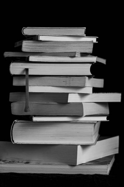 istock Stack of books isolated on a black background. 1492802731