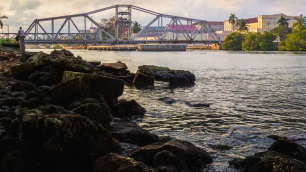 istock Steel bridge spanning a tranquil on the san juan river 1492803284
