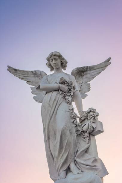 istock statue in front of sky with colorful sky at sunset, 1492803390