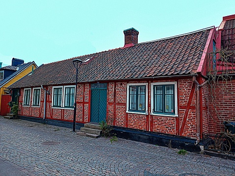 Halmstad, Sweden – April 27, 2022: Old half-timbered house in central Halmstad in Sweden