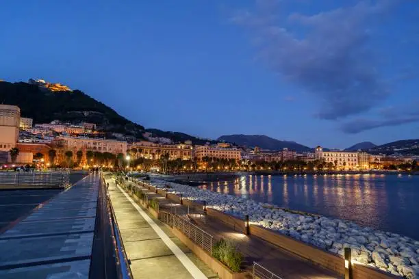 A beautiful shot of the glowing illuminated skyline near the shore of Salerno, Campania, Italy