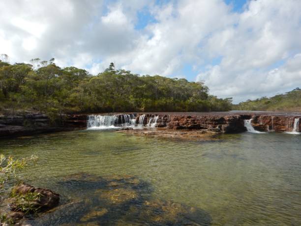 istock the waterfalls are flowing down to a waterfall next to rocks 1492807855