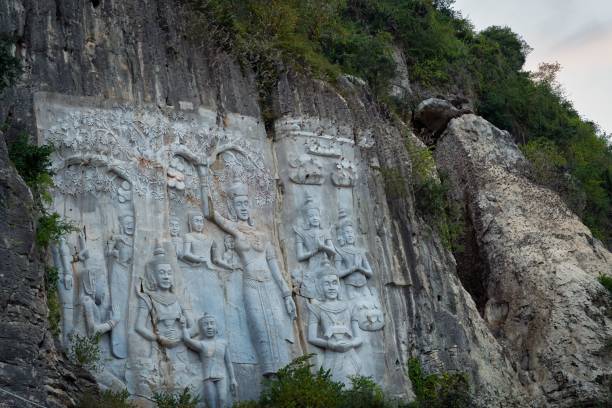 istock statues on the wall Bat Cave in battambang, cambodia 1492808525