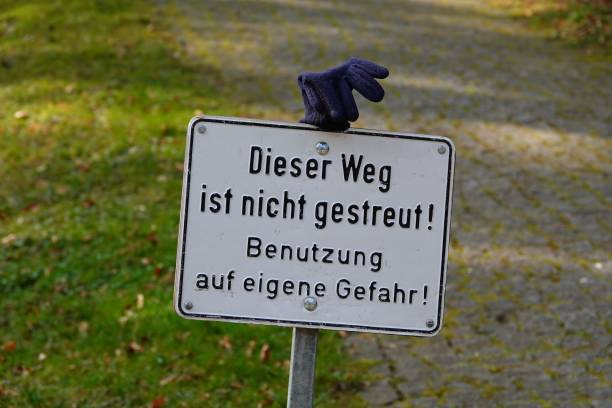 istock Glove conspicuously placed on a sign pole in the park 1492808631