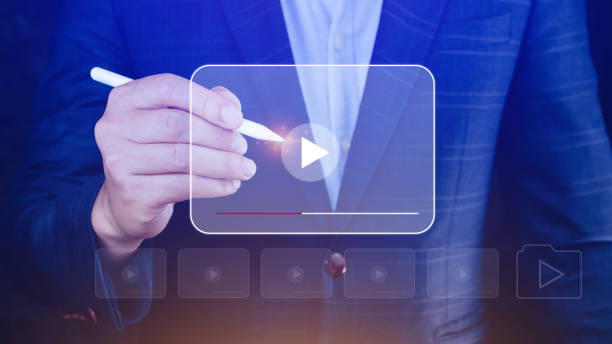 istock Businessman hands using for streaming online, watching video on internet, live concert, show or tutorial, content online. 1492811422