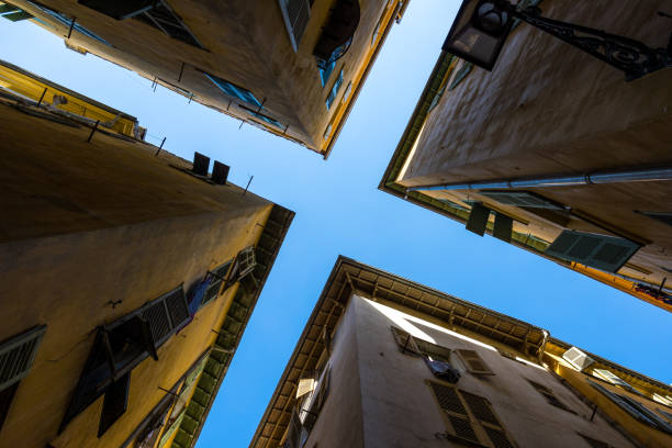 istock Blue sky above the intersection of two narrow streets in Old Nice 1492813970