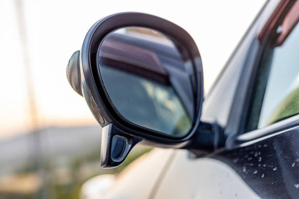 istock Side mirror of a vehicle with a secondary blind spot assistance mirror closeup with selective focus 1492814638