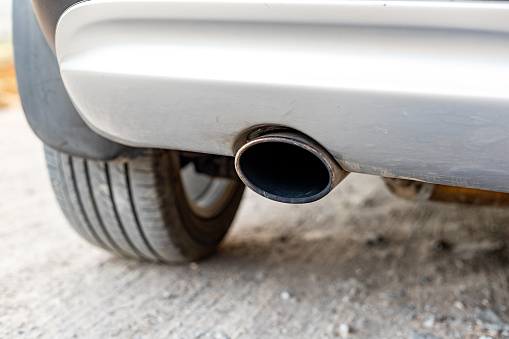 Black exhaust pipe of a vehicle closeup