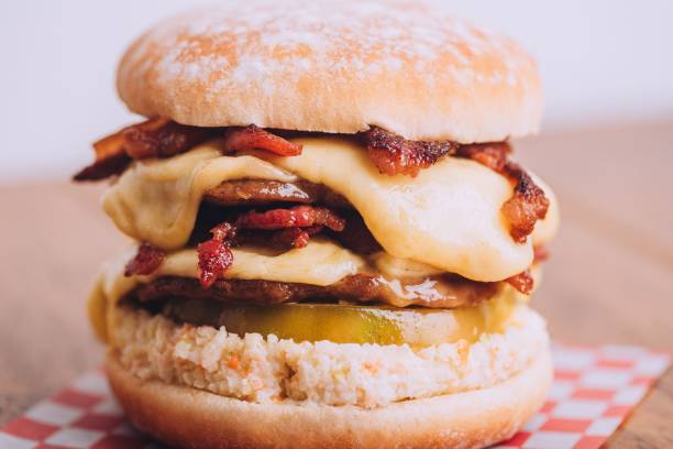 istock Closeup shot of an appetizing burger with bacon and cheese. 1492822143