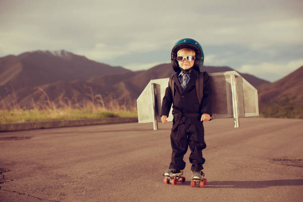 istock Young Boy Dressed as Businessman Wearing Jet Pack 149282427