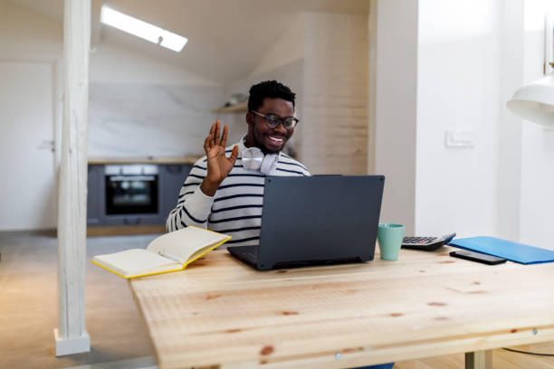 istock A young African man is working at home while using a laptop for a conference call. 1492824312