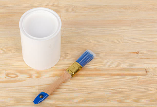 istock white paint with a brush on a wooden background with texture 1492826299