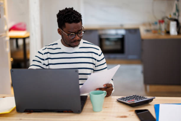 istock An African man is working from home analyzing business activities. 1492826322