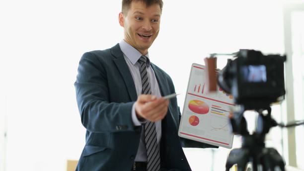 istock Freelancer business coach showing graphs to camera on video conference 1492828223