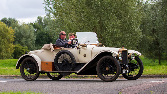 Stony Stratford, Bucks, UK Aug 29th 2021.  1913 cream  SUNBEAM SPORT vintage car travelling on an English country road