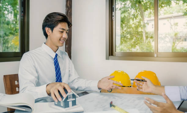 istock A team of engineers, contractors, meetings for housing projects, 1492830600
