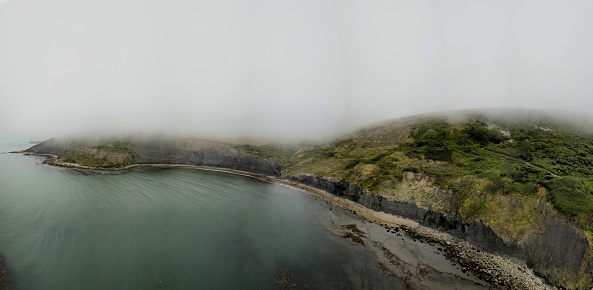 Aerial view of Chapman's Pool. Chapman's Pool is a small cove to the west of Worth Matravers on the Isle of Purbeck, in Dorset, England.\nThis area is part of famous Jurassic Coast where is possible find many fossils.