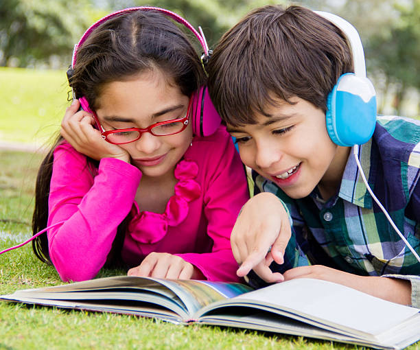 Kids reading at the park