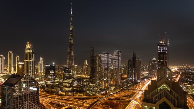 Dubai skyline time lapse from day to nigh with Burj Khalifa - aerial view, United Arab Emirates