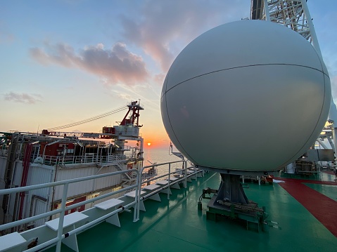 Radar detection system installed at a offshore gas processing facilities, sunrise background