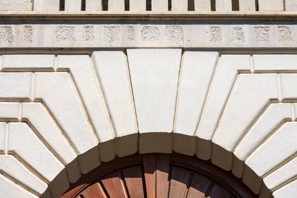 istock Medieval White Marble Arch with Keystone and Wooden Door 1492838577