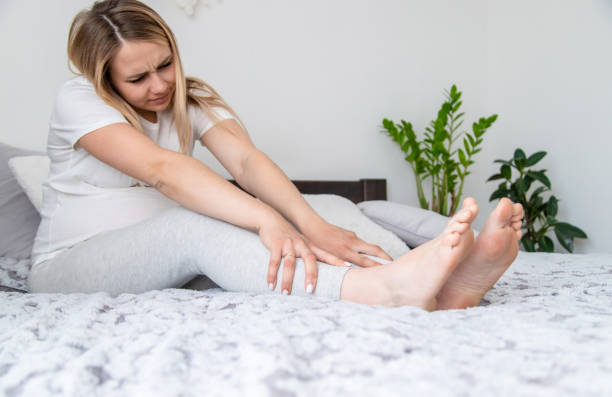 istock Pregnant woman legs are swollen. Selective focus. 1492838917