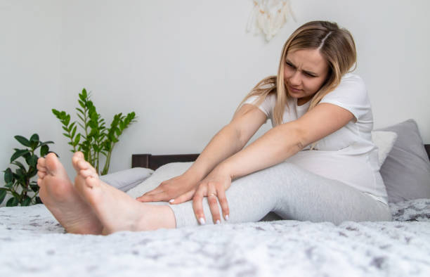 istock Pregnant woman legs are swollen. Selective focus. 1492838927