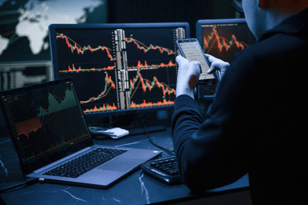 istock Rear view. Male professional hacker is sitting by computer, conception of virus 1492839162