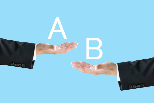 istock Business man's hands with alphabet A and B 1492842372