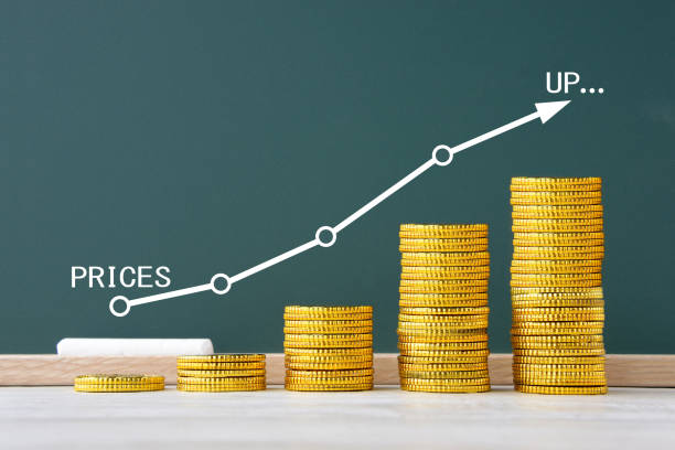 istock Handwritten graph for price on blackboard and coins 1492842951