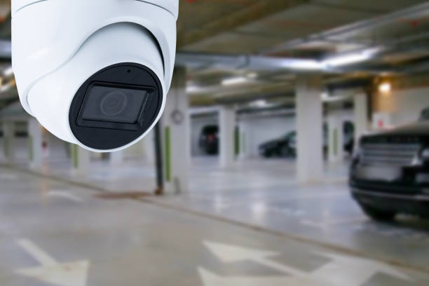 istock cctv camera installed on the parking lot to protection security. Copy space. 1492846500