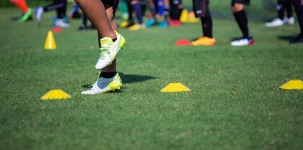 istock Athlete practicing running football sport on field equipment 1492846669
