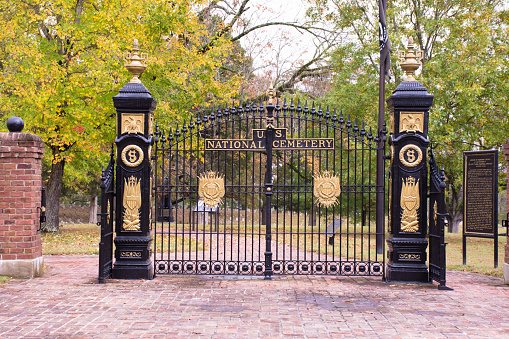 Black and Gold Gates at entrance to Shiloh National Cemetery, Tennessee. Gates closed, view into cemetery.