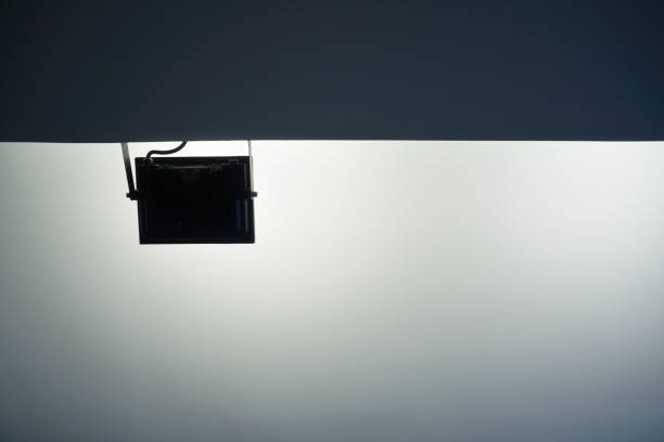 istock Abstract silhouette of spotlight contrast with lighting reflection at ceiling background 1492848771