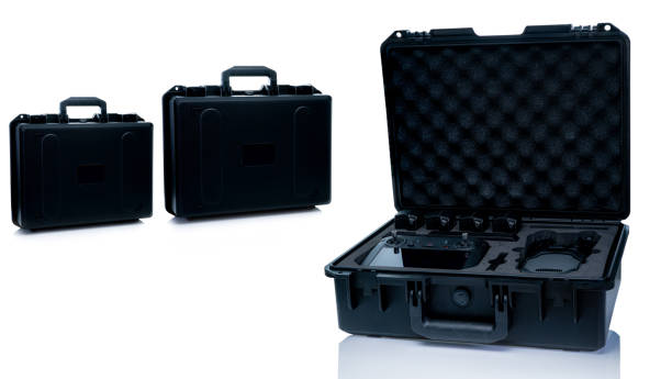 istock Drone and accessories in plastic case isolated on white background. UAV or unmanned aerial vehicle and drone accessories in protective travel case. LiPo rechargeable battery in storage container. 1492851330