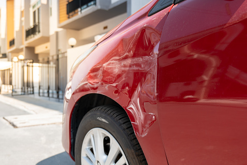 Close up on car accident, Red car after accident, Insurance car contact, Insurance car concept.