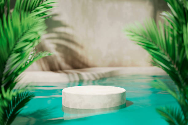Tropical summer background with concrete podium in pool water and palm leaf shadow. Luxury hotel resort exterior for product placement.