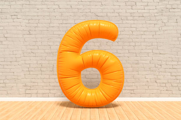 istock Number 6 balloon in room, brick wall background 1492856966