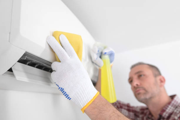 istock Service guy cleaning and maintaining air condition unit. 1492857789
