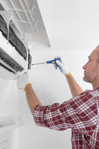 istock Service guy cleaning and maintaining air condition unit. 1492857817