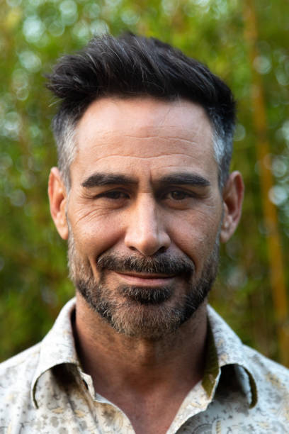 istock Vertical headshot of middle age white man with beard in nature. 1492858002
