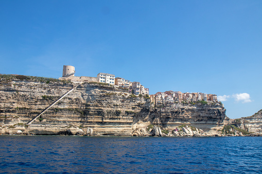 staircase of the king of aragon bonifacio, dug in the cliff, with its houses on the edge