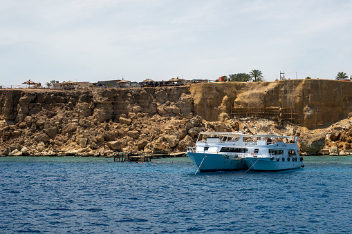 Hadaba, Sharm el Sheikh, Egypt - May 2023: Dive boats anchored at Temple dive site in Sharm el Sheikh, Egypt