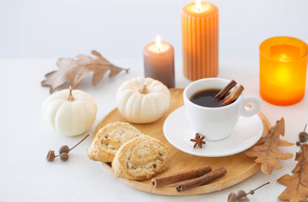 istock white cup of coffee with cozy decor on white table 1492865874